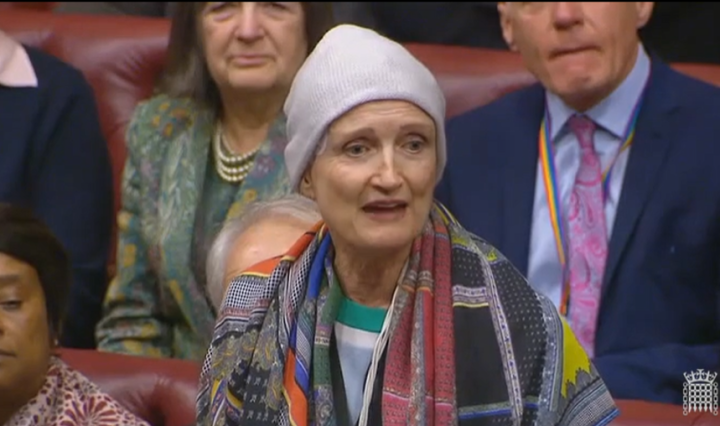 Tessa Jowell wearing a wool hat and brightly coloured scarf